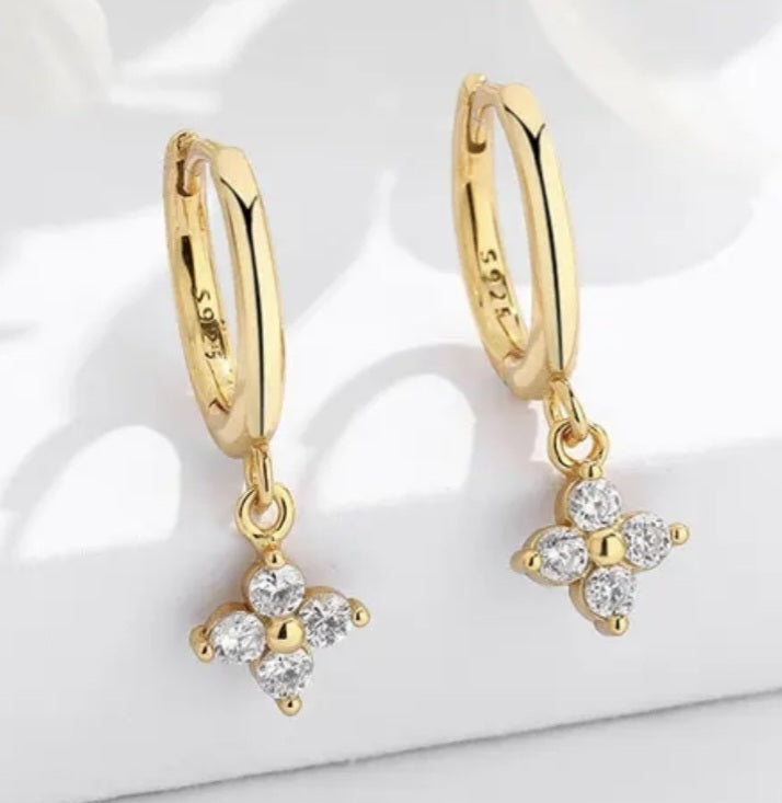 Gold earring with clear stones, cross shape